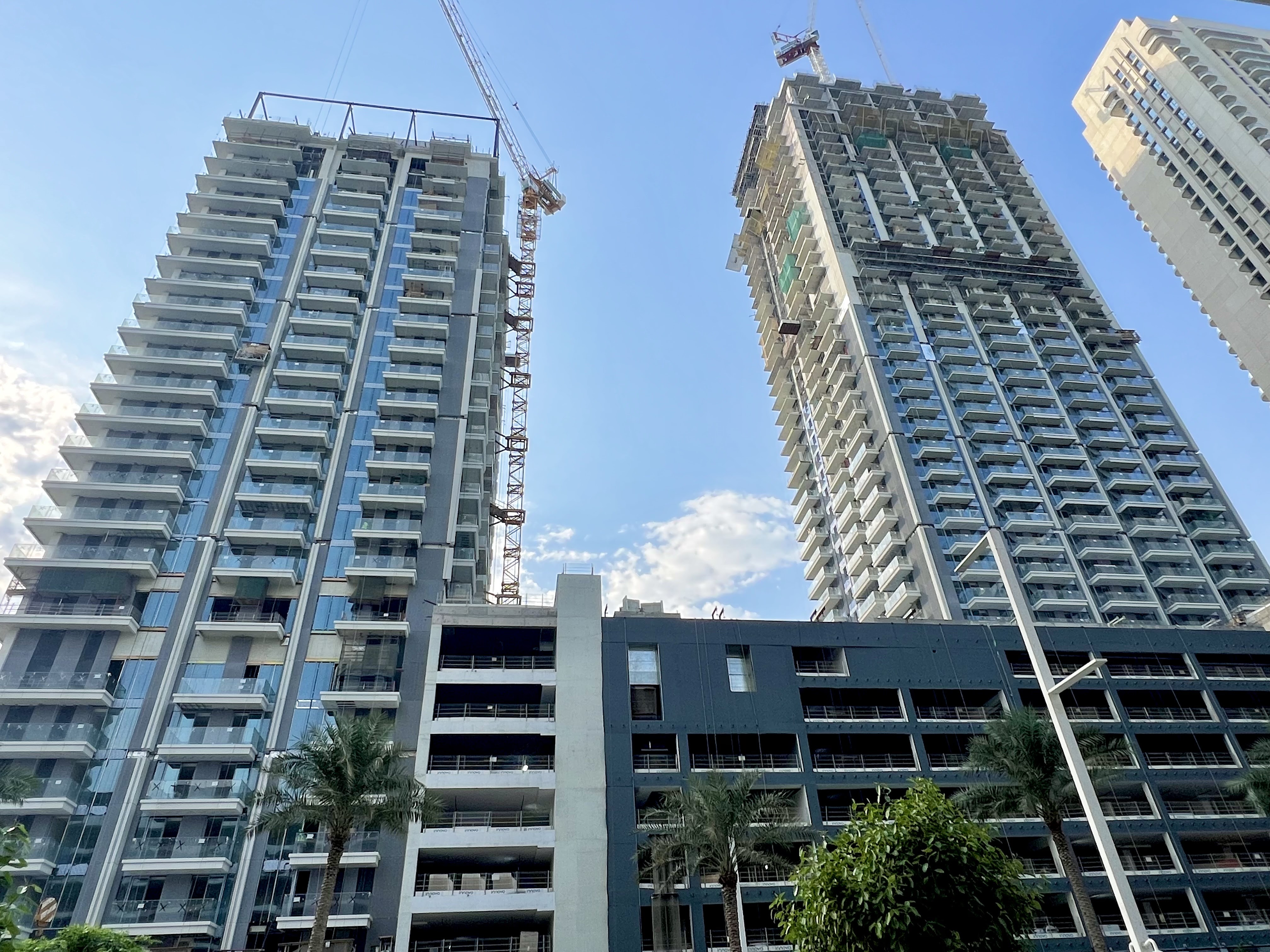 The Beach Mansion waterfront tower with sculptural glass façade and premium finishes